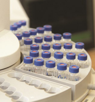 A lab kit setup with several slots filled with samples, while some rows remain empty.
